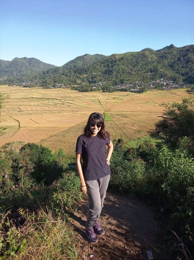 Me with spiderweb rice field in the background