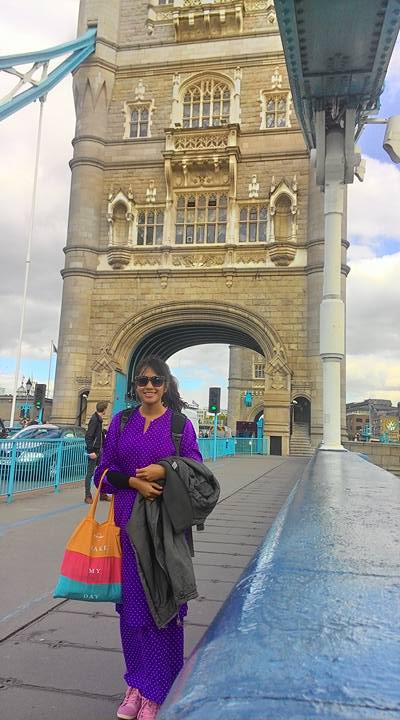 Wearing baju kurung on Tower Bridge